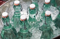 Free glass bottles in ice bucket public domain CC0 photo.