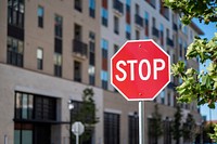 Free stop sign in a city image, public domain CC0 photo.