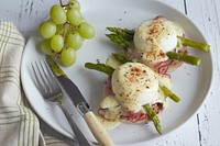 Free egg benedict with hollandaise sauce and grape image, public domain food CC0 photo.