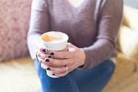 Free woman grabbing coffee cup photo, public domain beverage CC0 image.