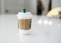 Free Starbucks coffee cup on table photo, public domain beverage CC0 image.