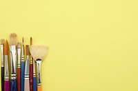 Paint brushes with yellow background, free public domain CC0 photo