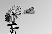 Free black & white windmill with sign image, public domain CC0 photo.