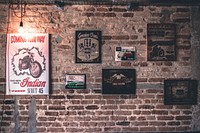 Free posters on brick wall image, public domain interior design CC0 photo.