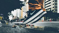 Nike sneakers, man jumping in a puddle - unknown date & location