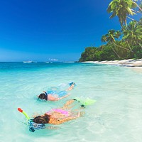 Couple snorkeling by the shore