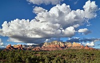 The famous red-sandstone formations that surround Sedona, Arizona, a popular tourist destination whose main attraction are these formations, many of which glow brilliant orange or red when illuminated by the rising or setting sun.