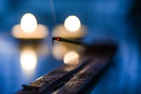 Incense in blurred background photo, free public domain CC0 image.