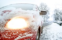 Car headlights covering with snow photo, free public domain CC0 image.