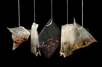 Free tea bags hanging on black background public domain CC0 photo