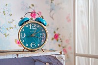 Blue alarm clock on the table photo, free public domain CC0 image.