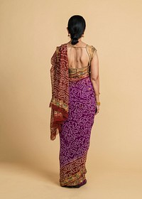 Rear view of an Indian woman in a traditional saree