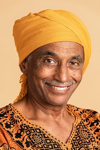 Mixed senior Indian man wearing a yellow turban