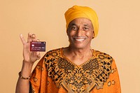 Happy mixed senior Indian man with a credit card 