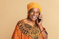 Senior mixed Indian man talking on the phone 