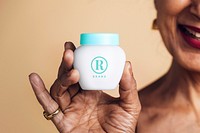 Indian woman holding a cream container mockup