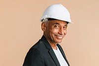 Mixed Indian engineer wearing a helmet for protection 