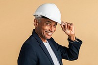 Mixed Indian engineer wearing a helmet for protection 