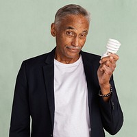 Mixed Indian senior man holding a light bulb mockup