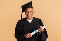 Proud senior man in a graduation gown holding his diploma