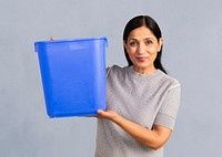 Senior Indian woman holding an empty blue container mockup