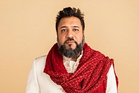 Indian man wearing a kurta with a red scarf 