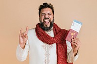 Happy Indian man in a kurta holding a passport with flight tickets 