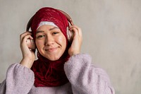 Muslim woman listening to music