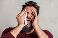 Sick Indian man having a migraine 