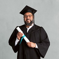 Happy senior man in a graduation gown holding his master&#39;s degree mockup
