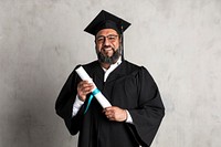 Happy senior man in a graduation gown holding his master's degree