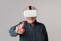Cheerful senior man wearing virtual reality goggles