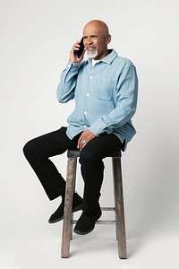 Happy retired man on the phone 