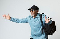 Cheerful black senior traveler wearing a cap  