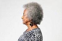 Black senior woman with afro hair in a profile shot