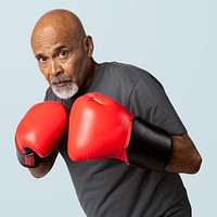 Senior man with red boxing gloves mockup