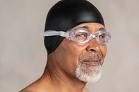 Senior African American swimmer wearing a swim cap and goggles