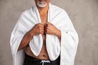 Senior African American man with a white bath towel