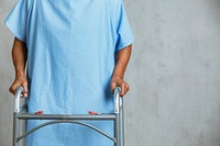 Patient using a zimmer frame 