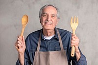 Senior American man wearing an apron