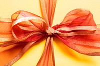 Orange ribbon gift box photo, free public domain CC0 image.