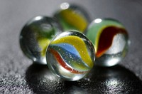 Glass marble ball retro toy image, free public domain CC0 photo.