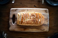 Fresh sliced bread on a wooden cutting board 