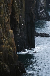 Steep cliff at Neist Point Lighthouse on the Isle of Skye in Scotland