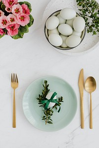 Aerial view of raw eggs on a white marble table