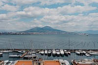 Boats docked at a pier in Naples, Italy