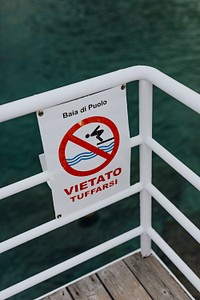 No diving sign on a boat at Puolo Bay, Italy