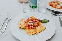 Ravioli with tomatoes and mozzarella Italian cuisine recipe