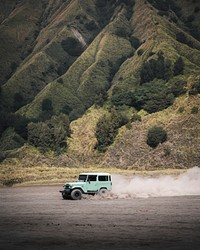 Cars driving on a beach