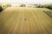 Drone view of a tractor on a field